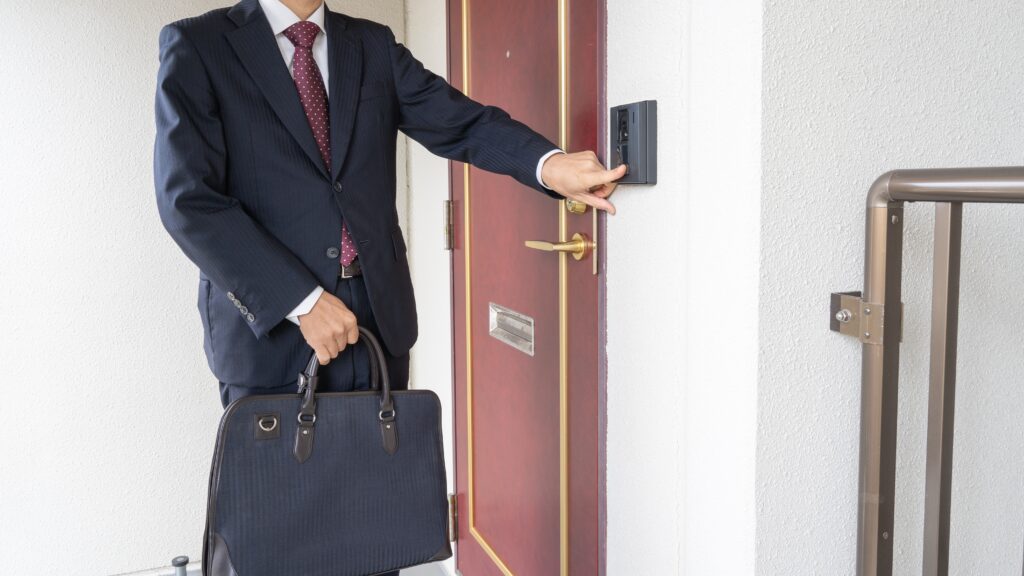 A door-to-door sales representative rings the intercom.
